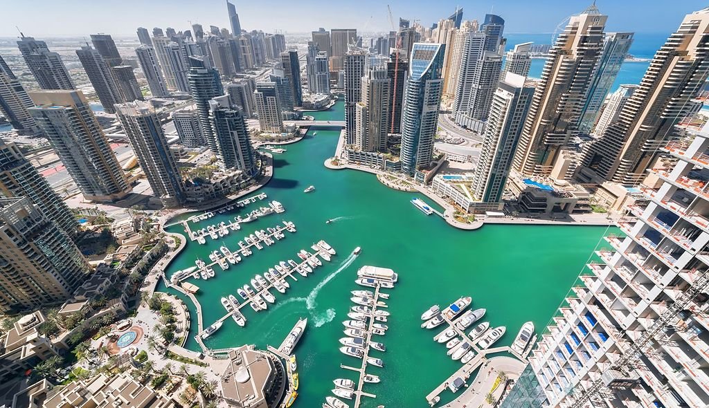 Aerial view of Dubai Marina towers and yachts, areas served by IIM Technical Services
