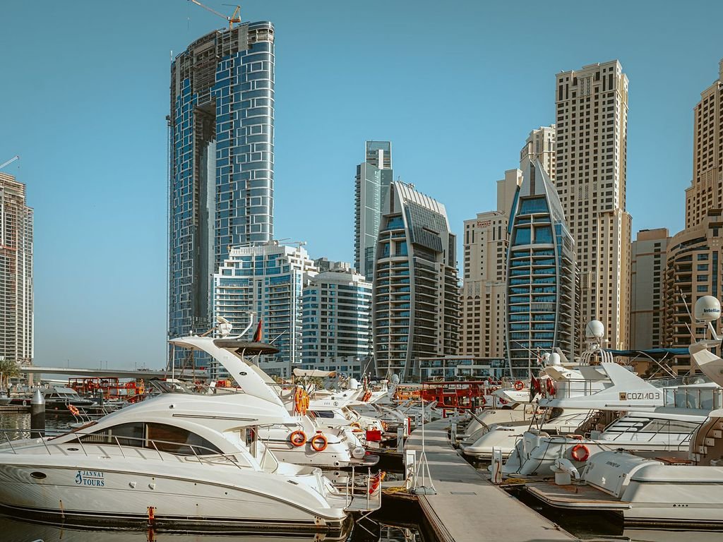 Dubai Marina apartment towers and yachts, an area served for apartment maintenance