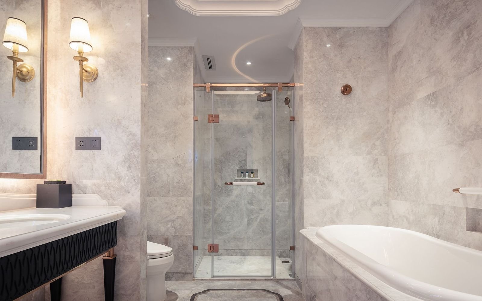 Marble bathroom with a glass shower and leak-free plumbing