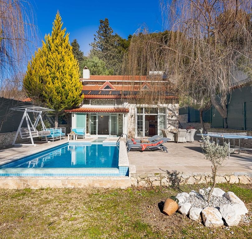 Villa with a private swimming pool and garden, the kind of home covered by villa maintenance
